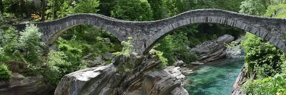 Stone bridge in Ticino, Switzerland, symbolising trust, stability and long-term Swiss wealth management by FF Marcuard SA in Lugano.
